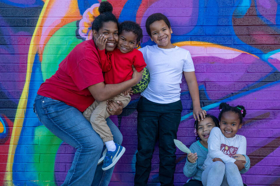 Family photo by mural